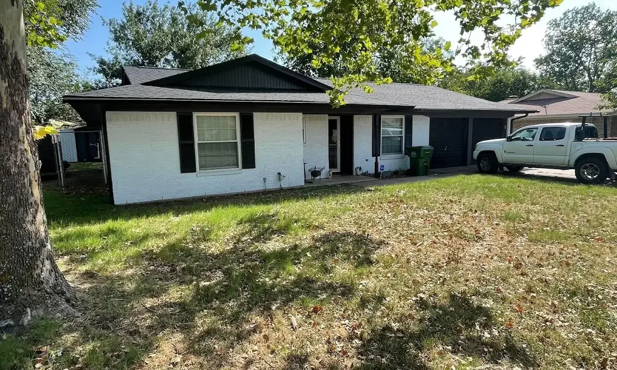 Professional roofing crew working on a residential roof in West Fargo